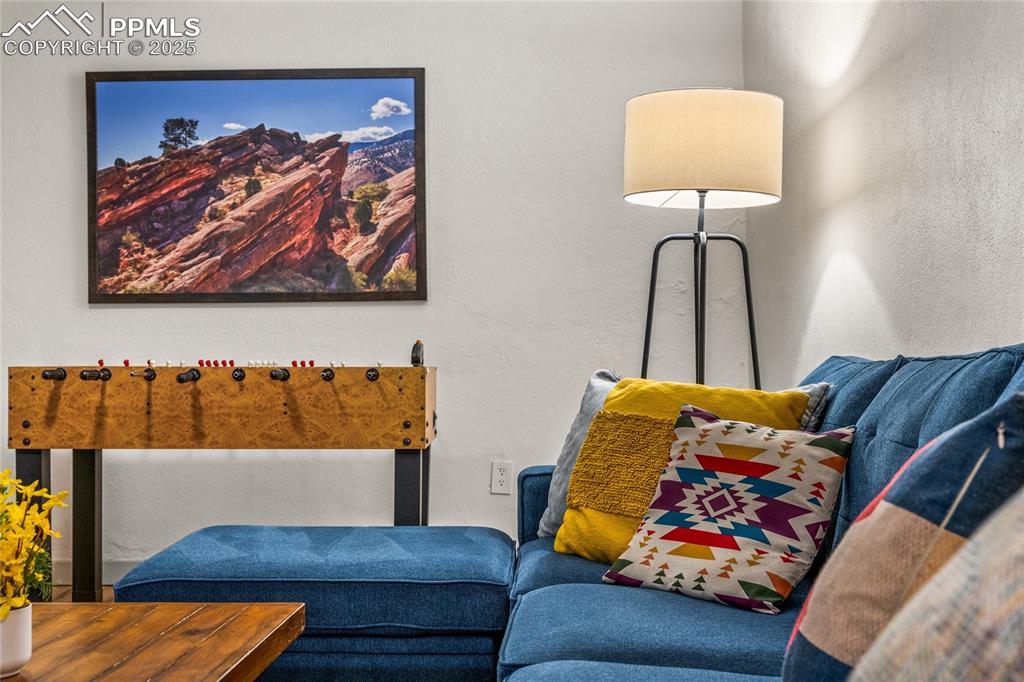 Image 28 of 42: Sitting room featuring a textured wall