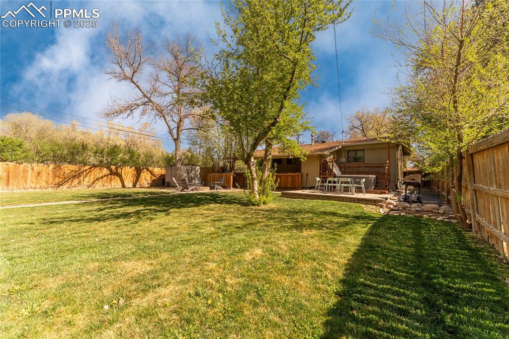 Image 37 of 42: Fenced backyard featuring a patio area