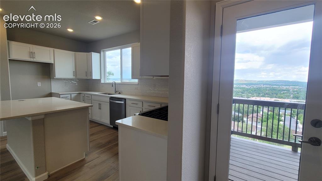 Image 16 of 32: Deck right off the kitchen!