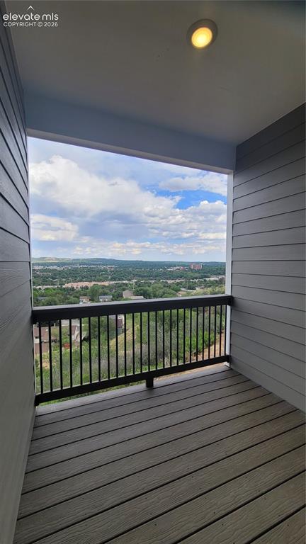 Image 17 of 32: Covered composite deck off the kitchen, yielding spectacular views! 