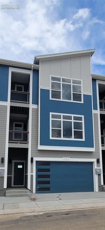 Image 2 of 32: Peak View-Modern Elevation-Interior Unit-2 Car Garage-Townhome-Backs to Ope