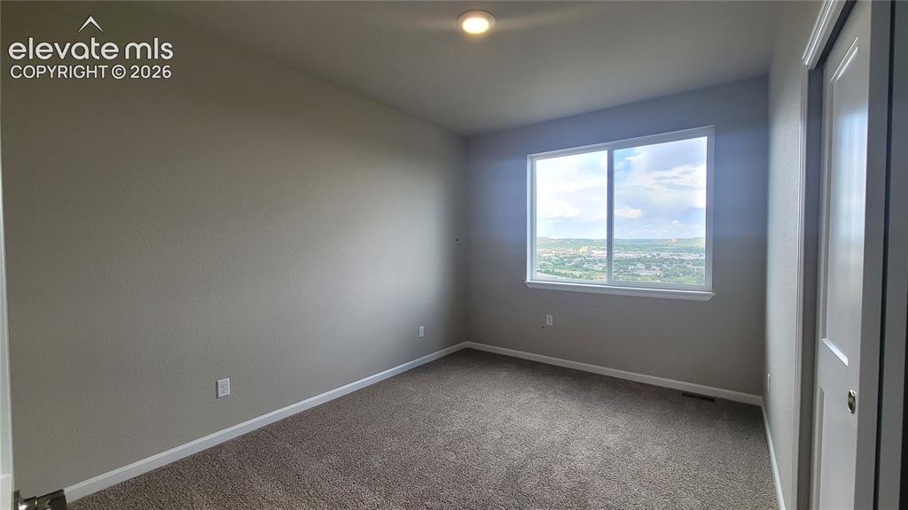 Image 21 of 32: 3rd Bedroom, located on the upper level! 