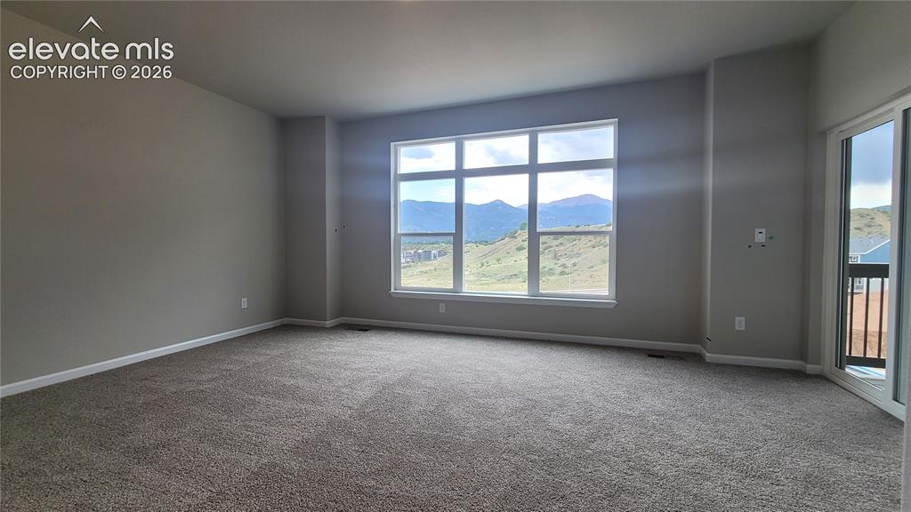 Image 24 of 32: Primary Suite is accompanied with a plush bathroom, walk-in closet, private