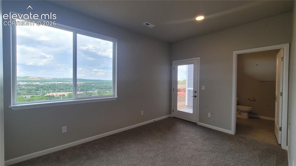 Image 4 of 32: Junior Suite at Entry Level with a 3/4 bathroom and walks out to private pa