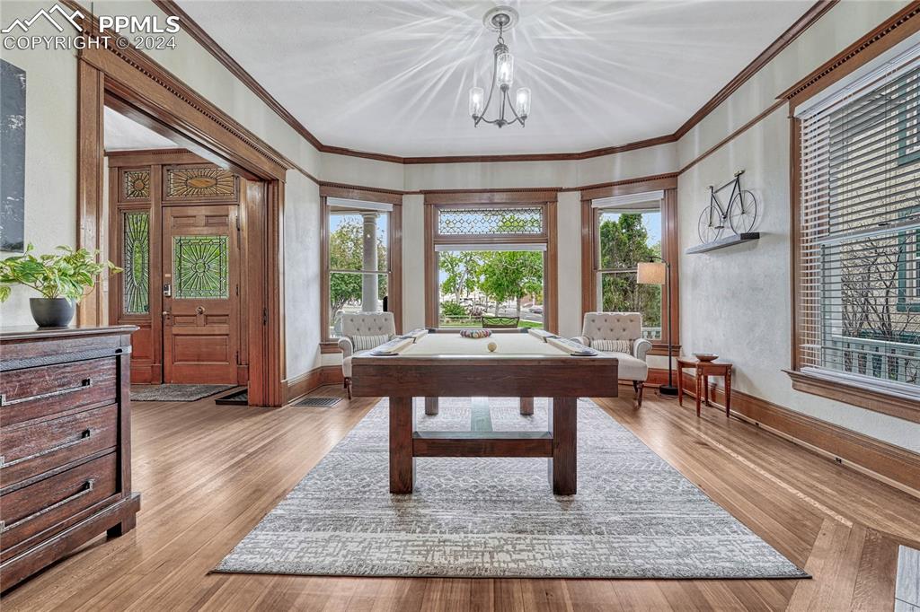 Image 7 of 50: , Recreation Room, Game Room, Carpeted, Wooden Floor