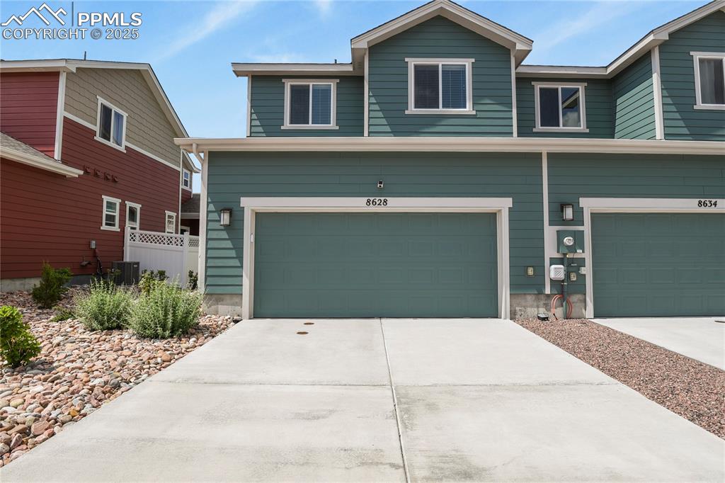 Image 18 of 20: The finished garage includes an insulated door, WiFi opener, and LED lighti