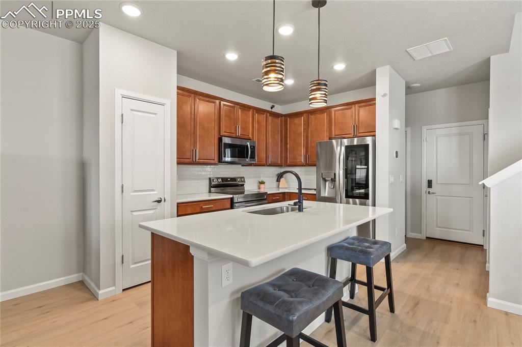 Image 6 of 20: Gourmet kitchen with quartz countertops, 42” cabinets, stainless steel sink