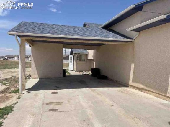 Image 4 of 8: View of car parking featuring a carport