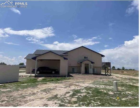 Image 7 of 8: View of front facade with a garage