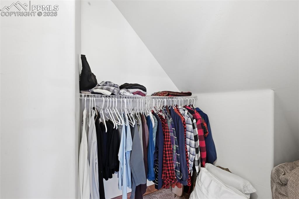 Image 28 of 50: Second walk-in closet for the primary retreat.