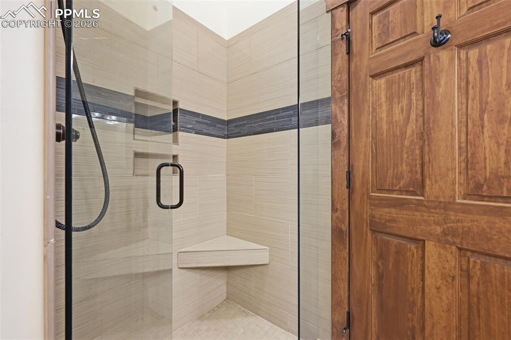 Image 30 of 50: Primary Bathroom has a glass enclosed shower.