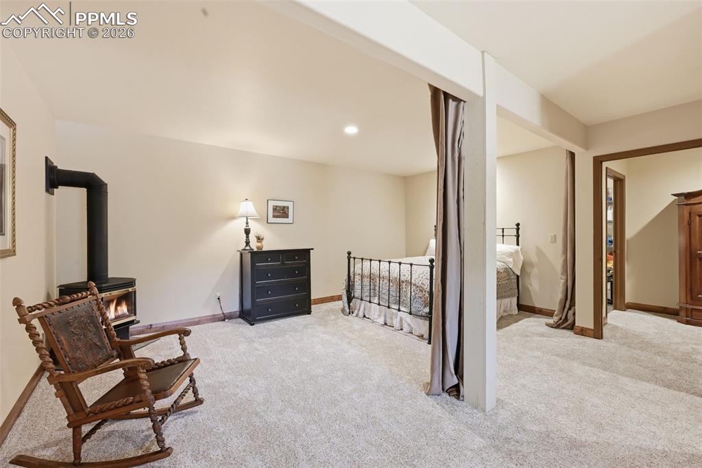 Image 31 of 50: The garden level family room is currently configured to as a guest bedroom.