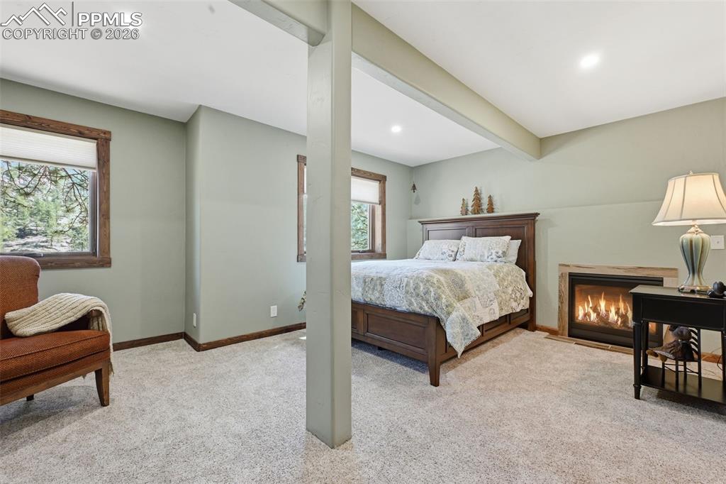Image 36 of 50: Newly refinished garden level offers a reading nook and a propane fireplace