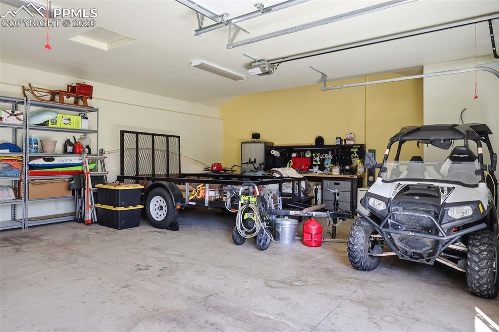 Image 41 of 50: 2 1/2 car garage provides ample storage and a place for your hobby workshop