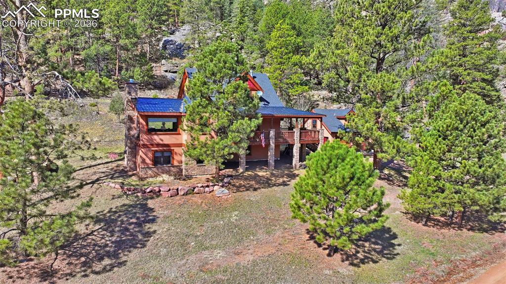 Image 8 of 50: The elevated entrance helps provide stunning views from the porch and throu