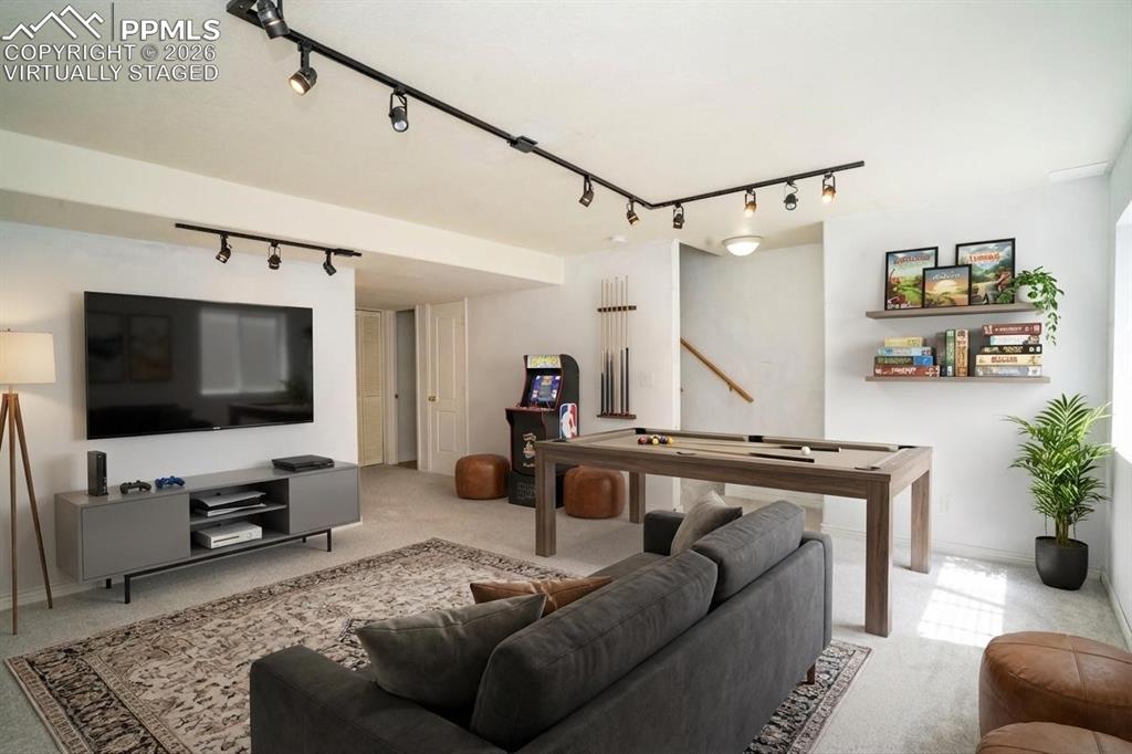 Image 32 of 43: Virtually staged as game room, basement