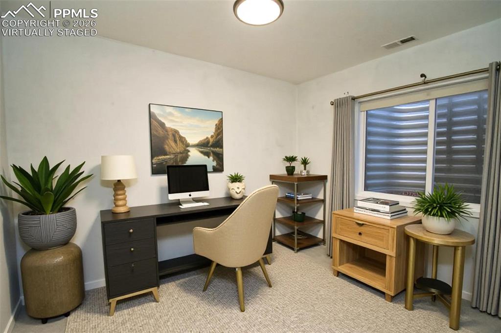 Image 35 of 43: Virtually staged as an office, basement