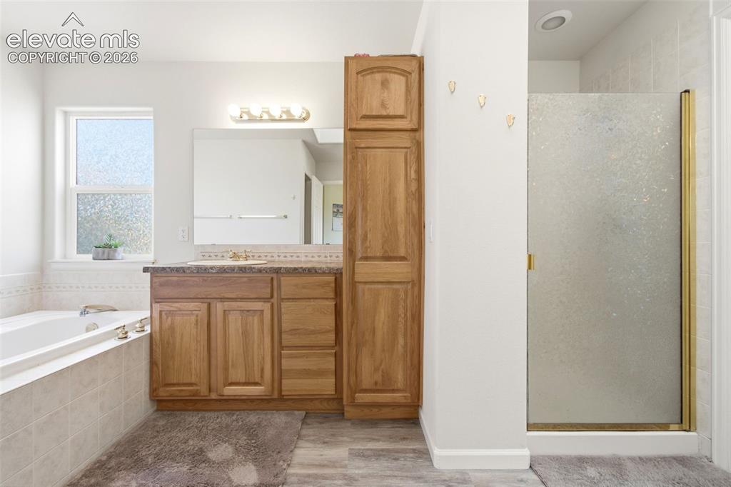 Image 17 of 44: Spa-inspired primary 5-piece bathroom 