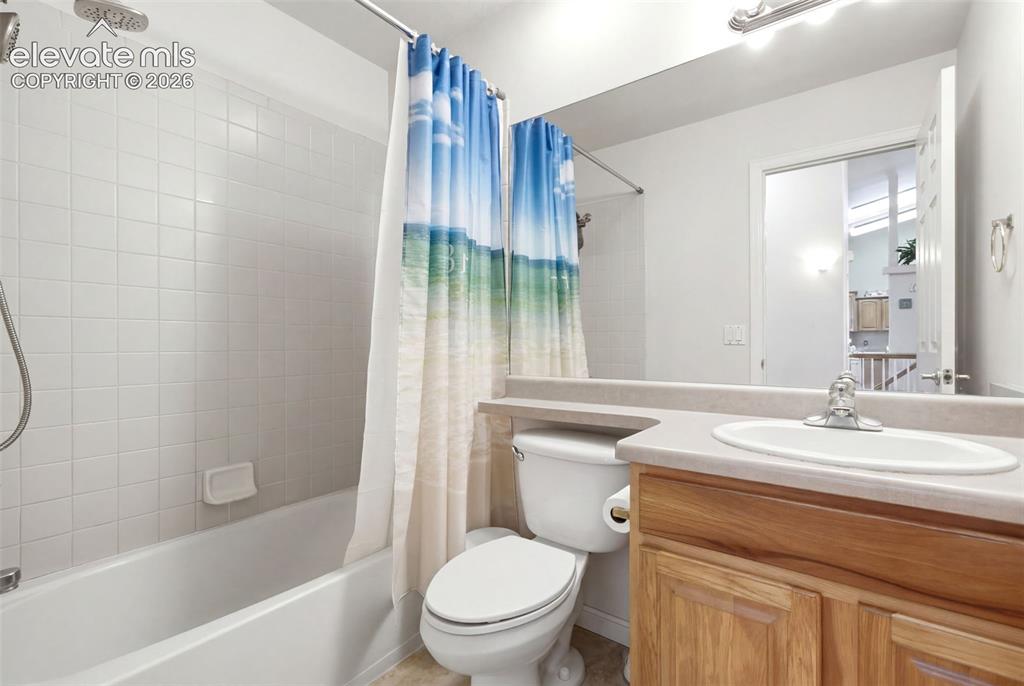 Image 23 of 44: Secondary, main-level bathroom