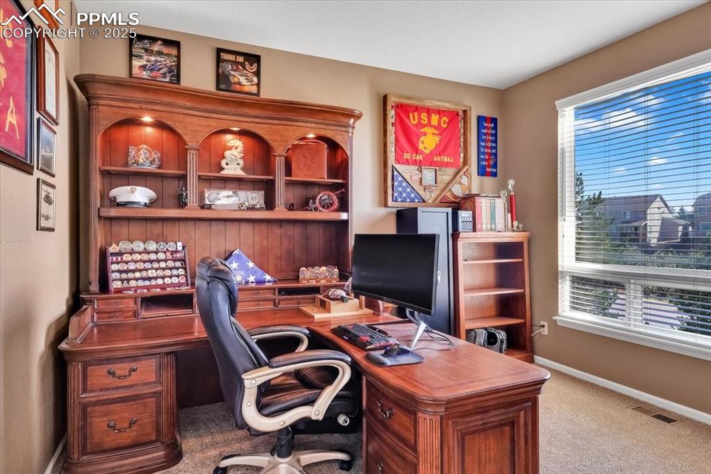 Image 18 of 30: Office with baseboards and light colored carpet