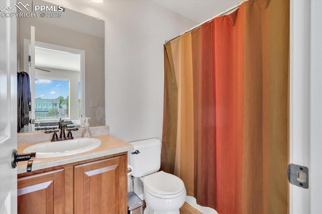 Image 23 of 30: Bathroom with vanity and a shower with curtain