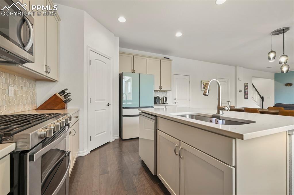 Image 12 of 50: Kitchen view toward dining and living rooms