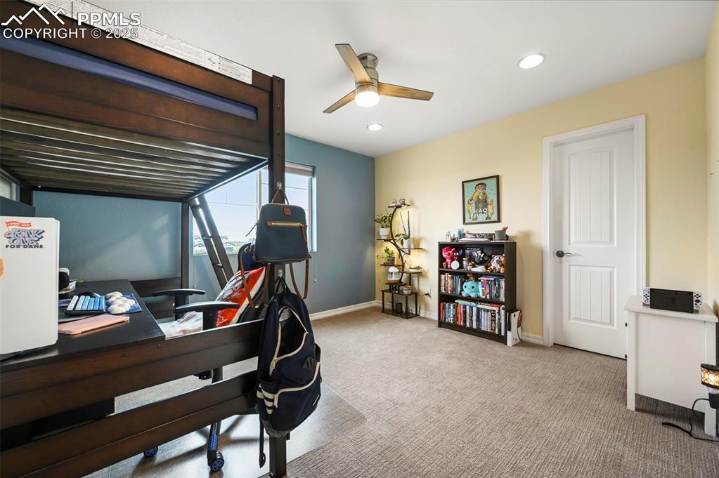 Image 27 of 50: Bedroom 3 with carpet, recessed lighting, and ceiling fan