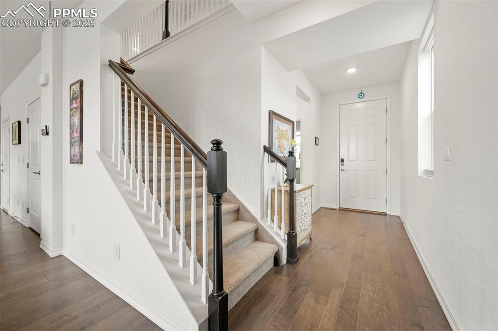 Image 31 of 50: Entrance foyer from living room to front door