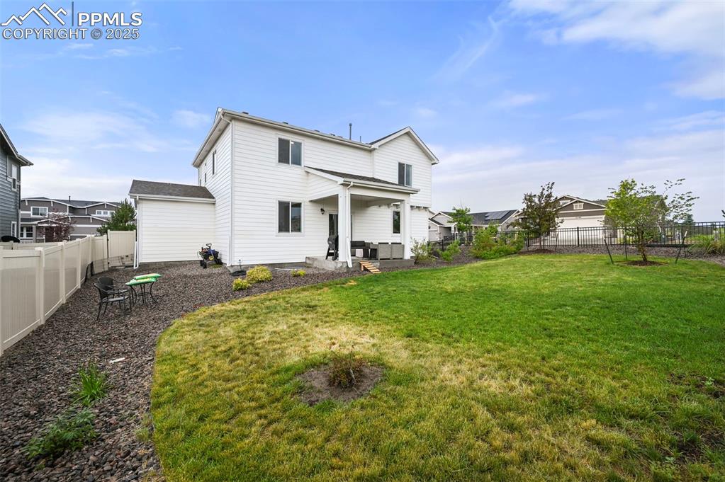 Image 40 of 50: Rear view of property with a fenced backyard