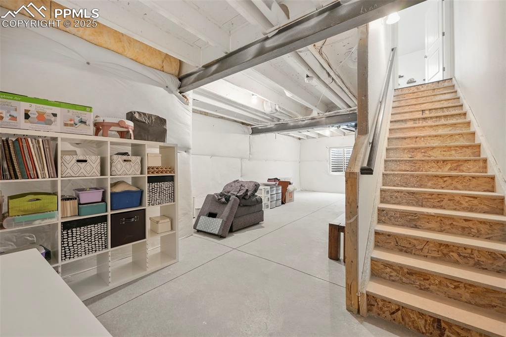 Image 43 of 50: Basement stairs from living/dining room