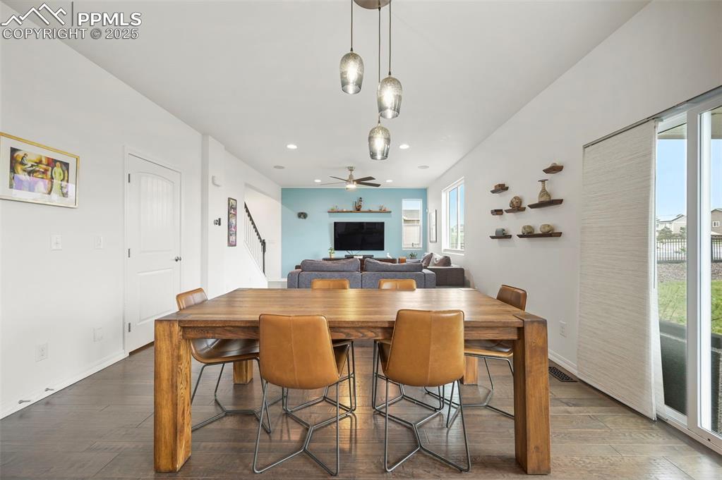 Image 8 of 50: Dining area looking back into living room.  Closed door leads to basement 