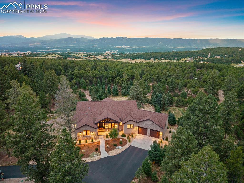 Caption: Front of house with stunning views of Pikes Peak and the Air Force Academy