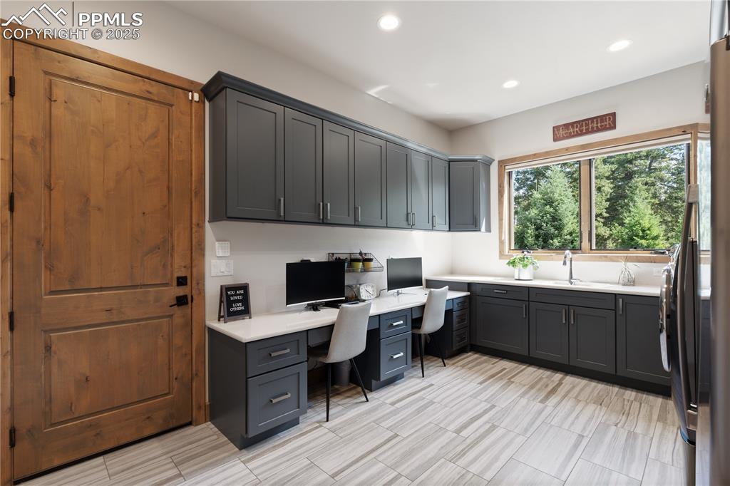 Image 21 of 49: Mudroom/homework area/laundry room
