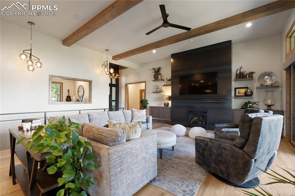Image 7 of 49: Main level living area with gas fireplace