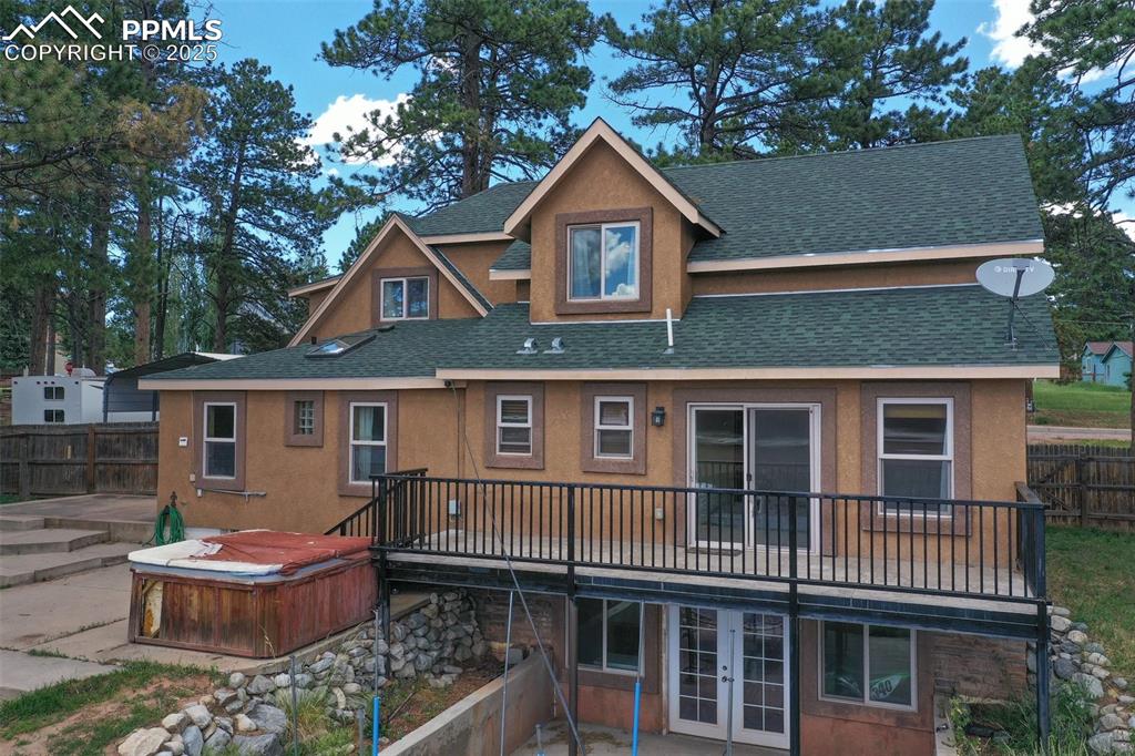Image 38 of 43: Hallway leading to downstairs with a large storage closet.