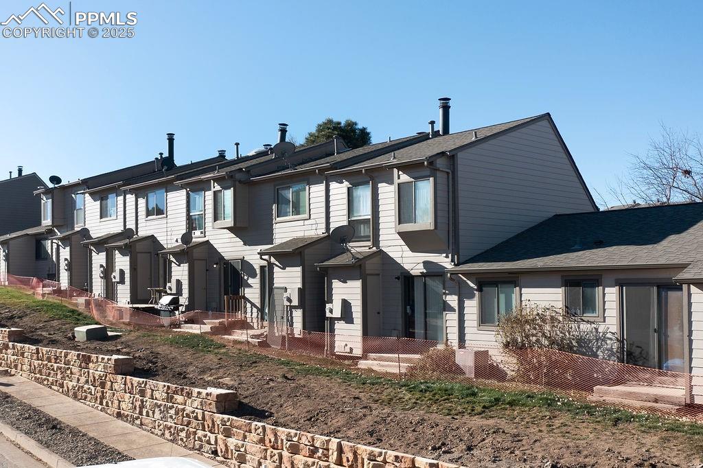 Image 47 of 48: View of front of property featuring a residential view and a shingled roof