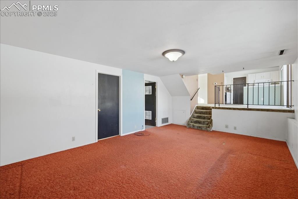 Image 11 of 33: Lower level family room.