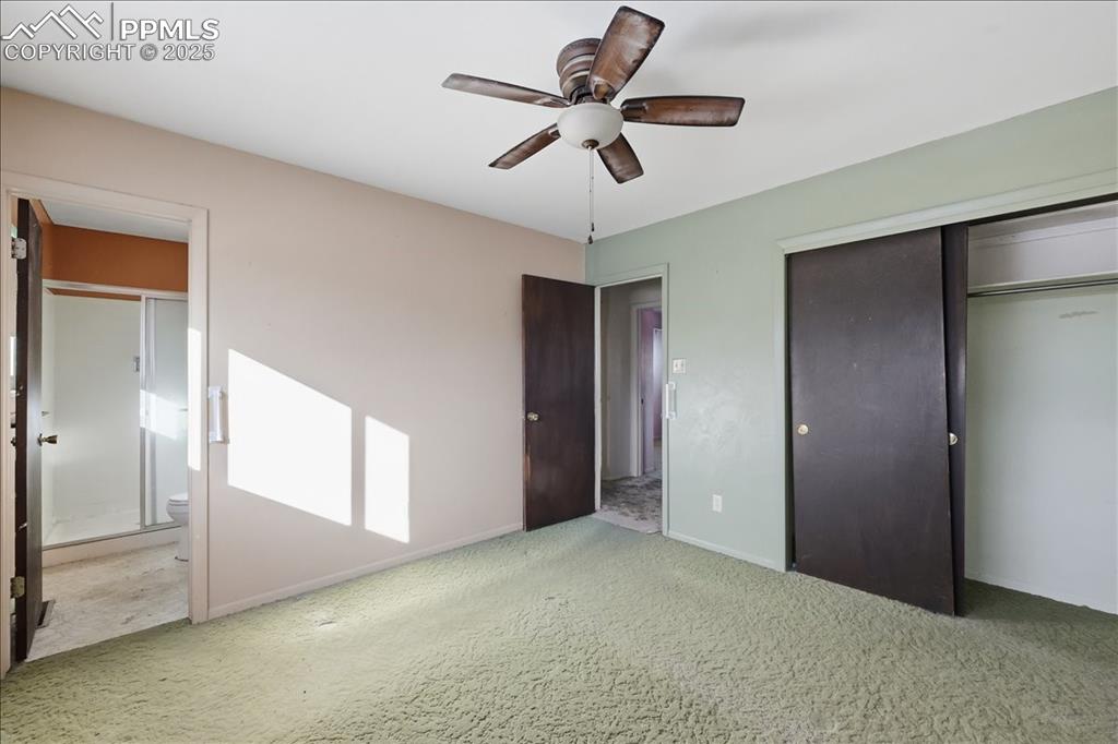 Image 20 of 33: Primary bedroom with attached bathroom.