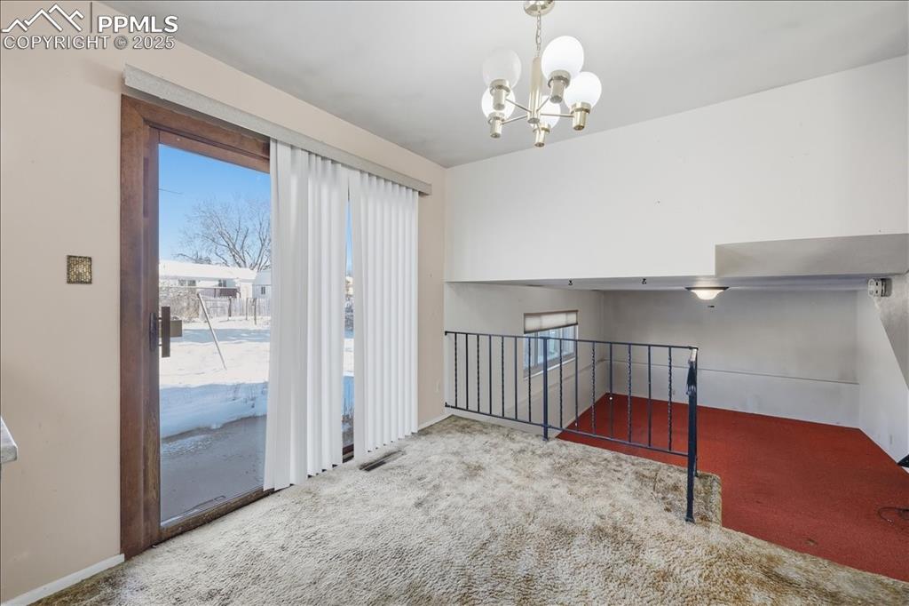 Image 8 of 33: Sliding door to the rear patio.