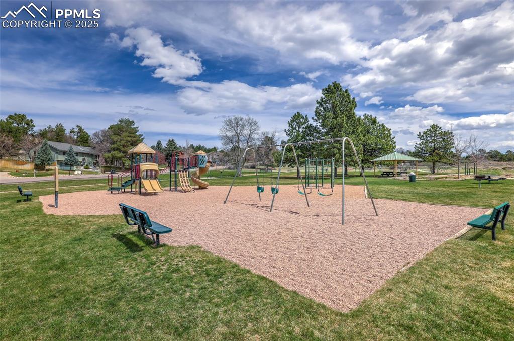 Image 48 of 49: Community play area featuring a yard
