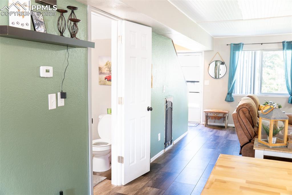 Image 8 of 35: Is that a dog kennel/storage under the stairs?