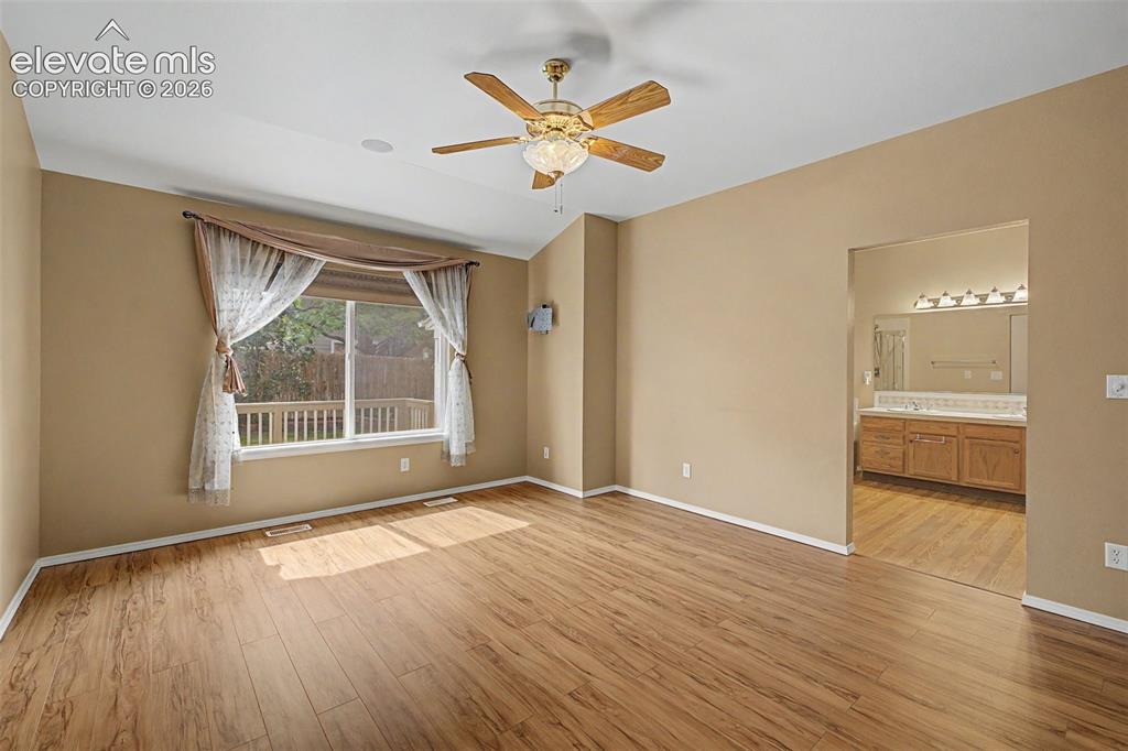 Image 26 of 49: Room featuring wood-finish flooring and neutral-toned walls