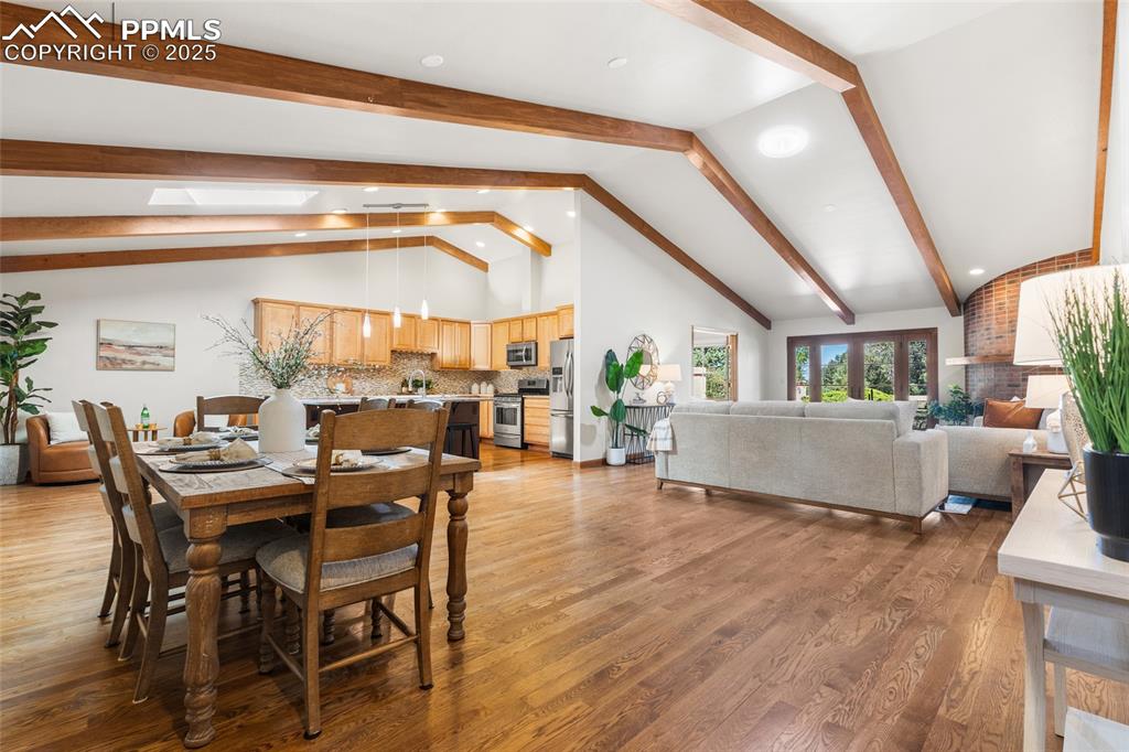 Image 4 of 36: Soaring Beamed Ceilings With An Open Concept Floorplan