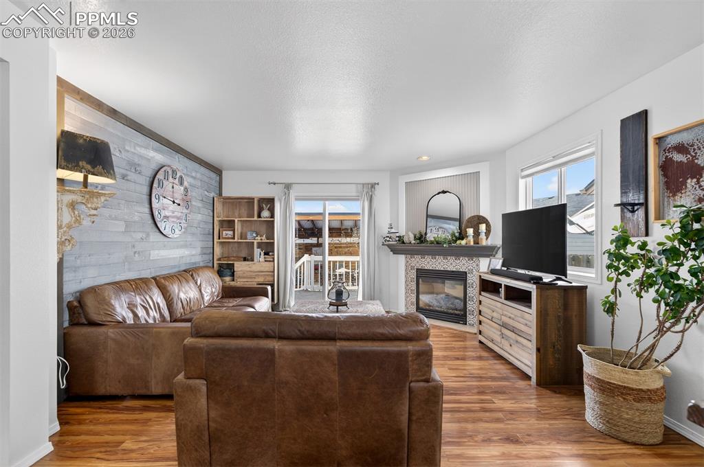 Image 3 of 37: Open Concept Living Room w/gas fireplace.