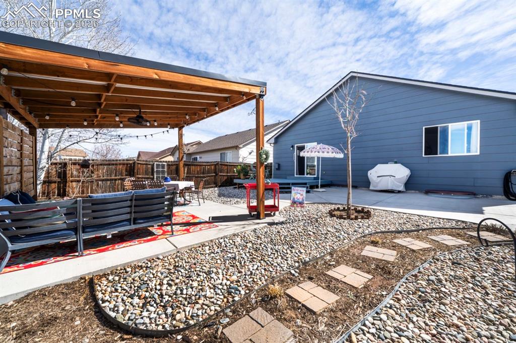 Image 34 of 37: Back Deck, Patio, and Pergola
