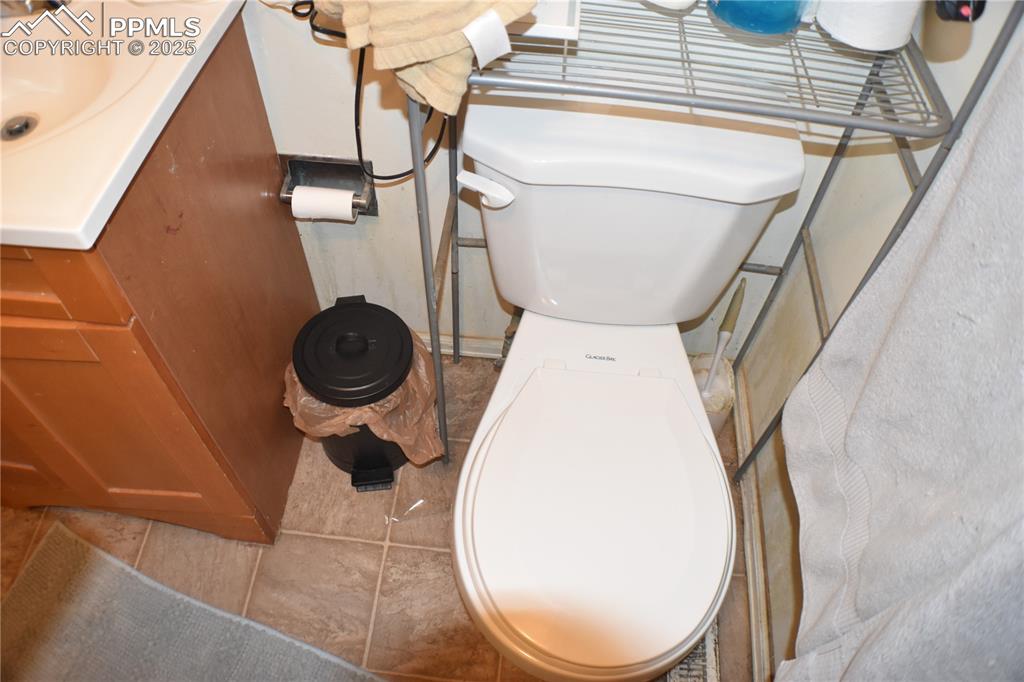Image 13 of 31: Bathroom with toilet and vanity