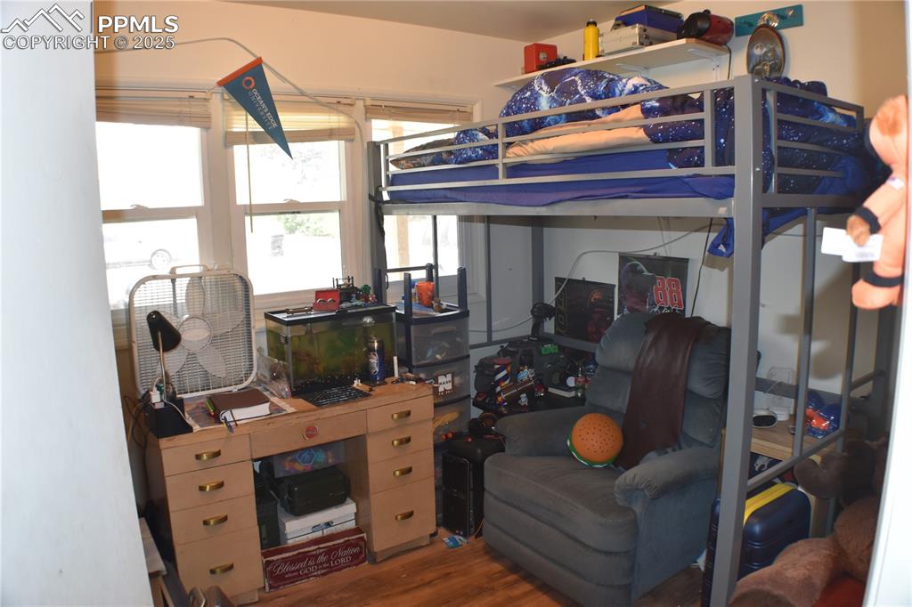 Image 18 of 31: Bedroom featuring wood finished floors