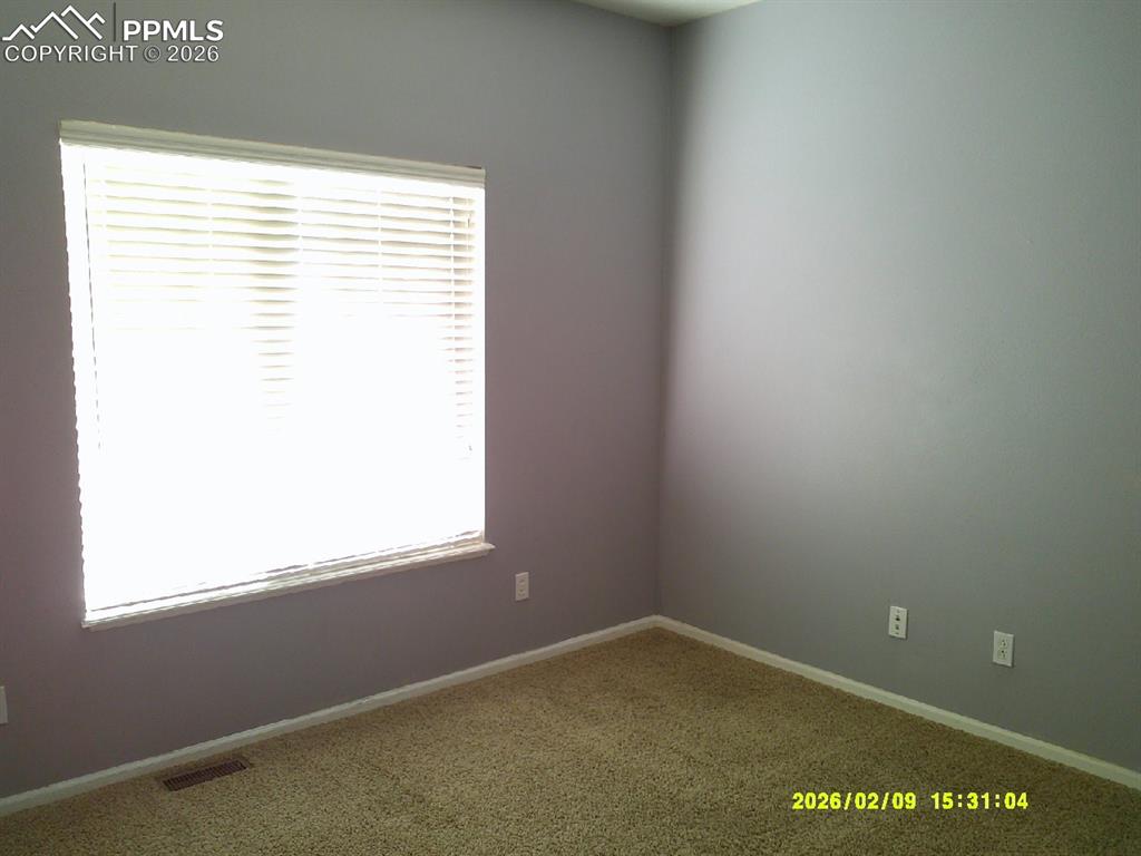Image 5 of 21: Unfurnished room featuring carpet and baseboards