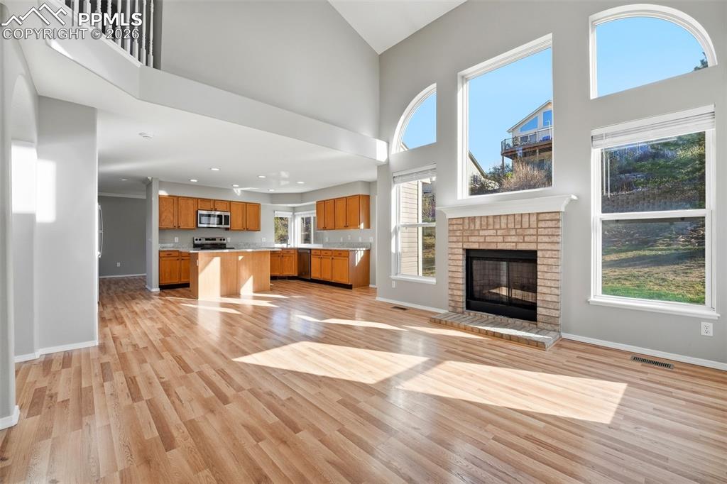 Image 13 of 49: Flows into kitchen with walkout to patio