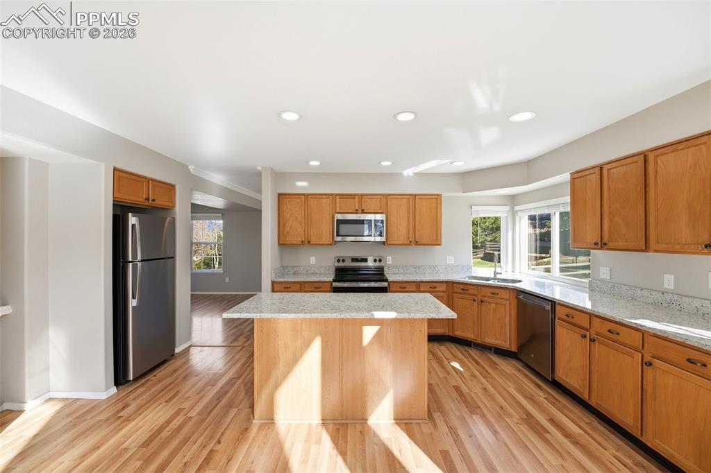 Image 15 of 49: Granite counters and stainless steel appliances